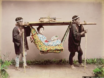 Japanese Geisha being carried in a litter